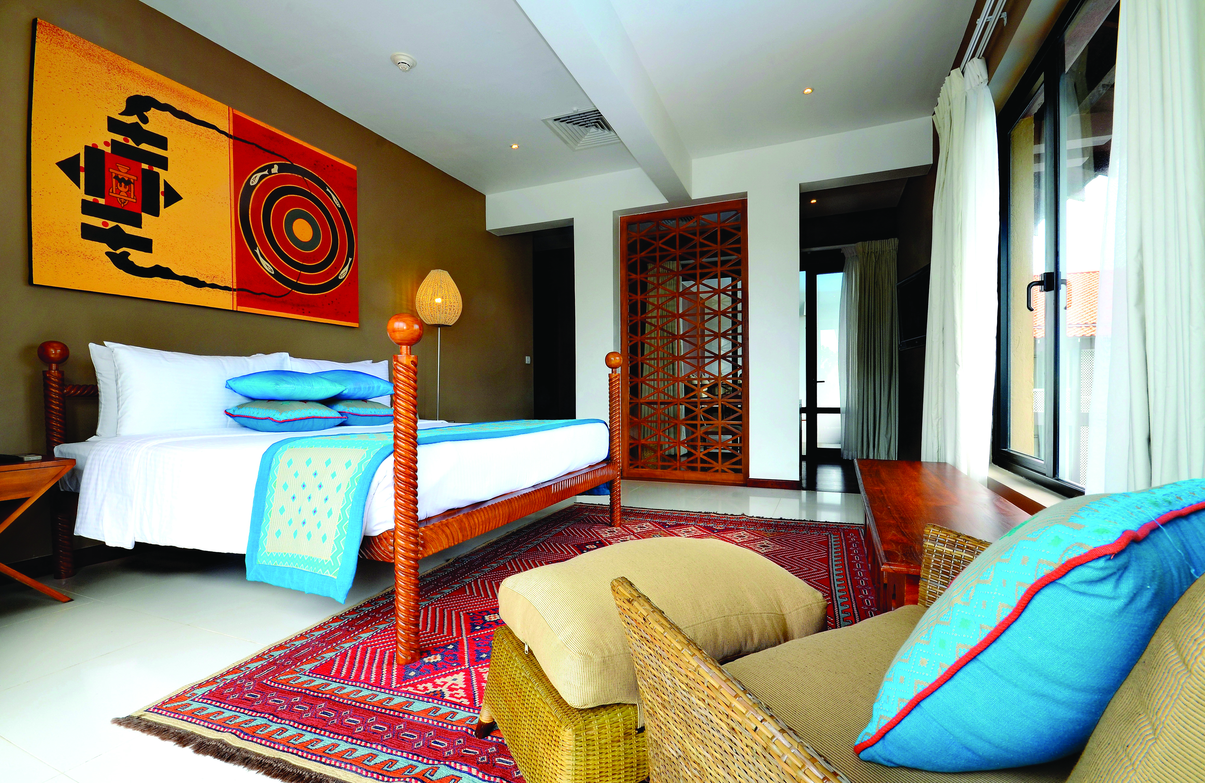 Cinnamon Bey Sri Lanka suite bedroom bed armchair modern décor