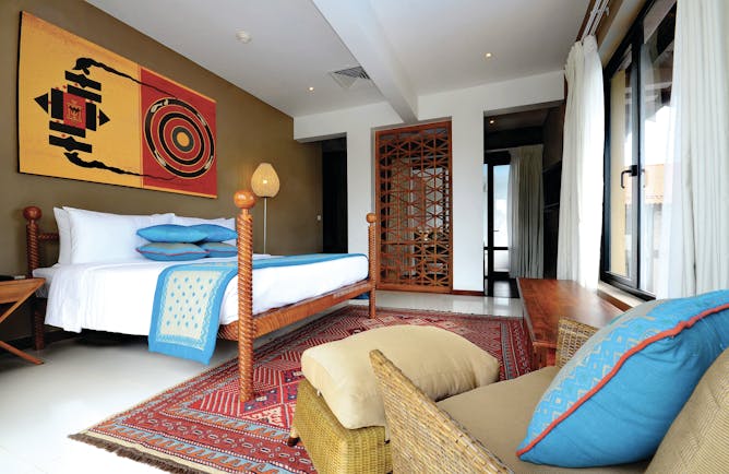 Cinnamon Bey Sri Lanka suite bedroom bed armchair modern décor