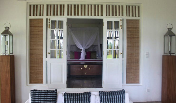 Club Villa Sri Lanka Club Suite lounge sofas with window to bedroom