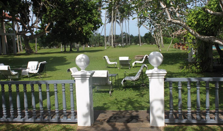Club Villa Sri Lanka garden lawn area lounge chairs and trees