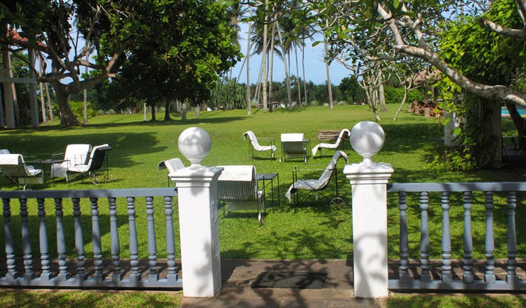 Club Villa Sri Lanka garden lawn area lounge chairs and trees