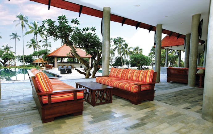Hikka Tranz Sri Lanka terrace outdoor seating area sofas overlooking pool