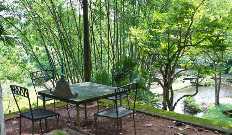 Lunuganga Sri Lanka garden patio view of trees and pond