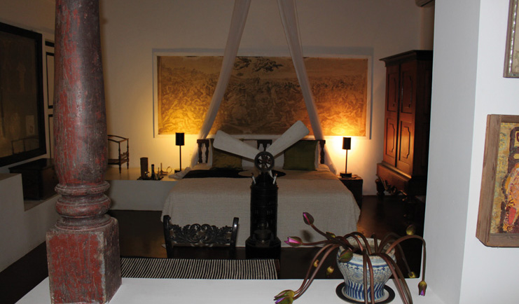 Lunuganga Sri Lanka main house bedroom with large painting fan and canopy