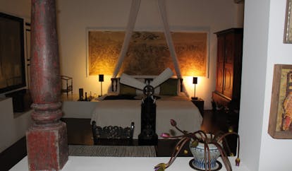 Lunuganga Sri Lanka main house bedroom with large painting fan and canopy