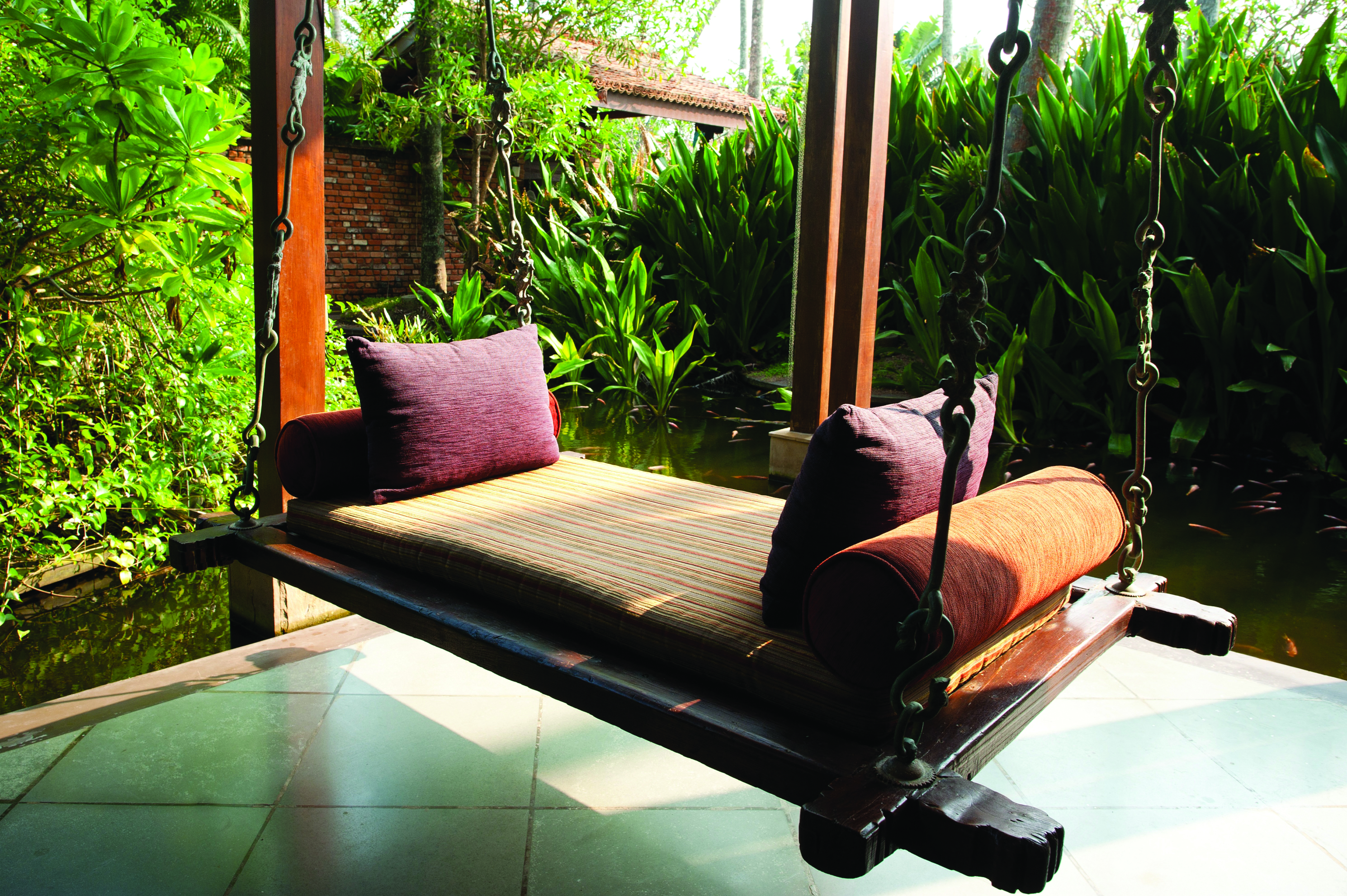 Reef Villa and Spa bench swing, suspended bench overlooking ponds