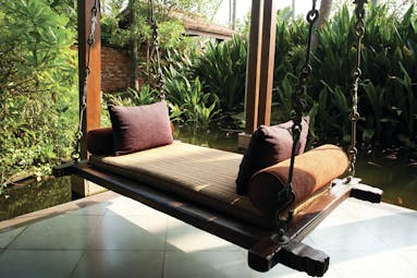Reef Villa and Spa bench swing, suspended bench overlooking ponds