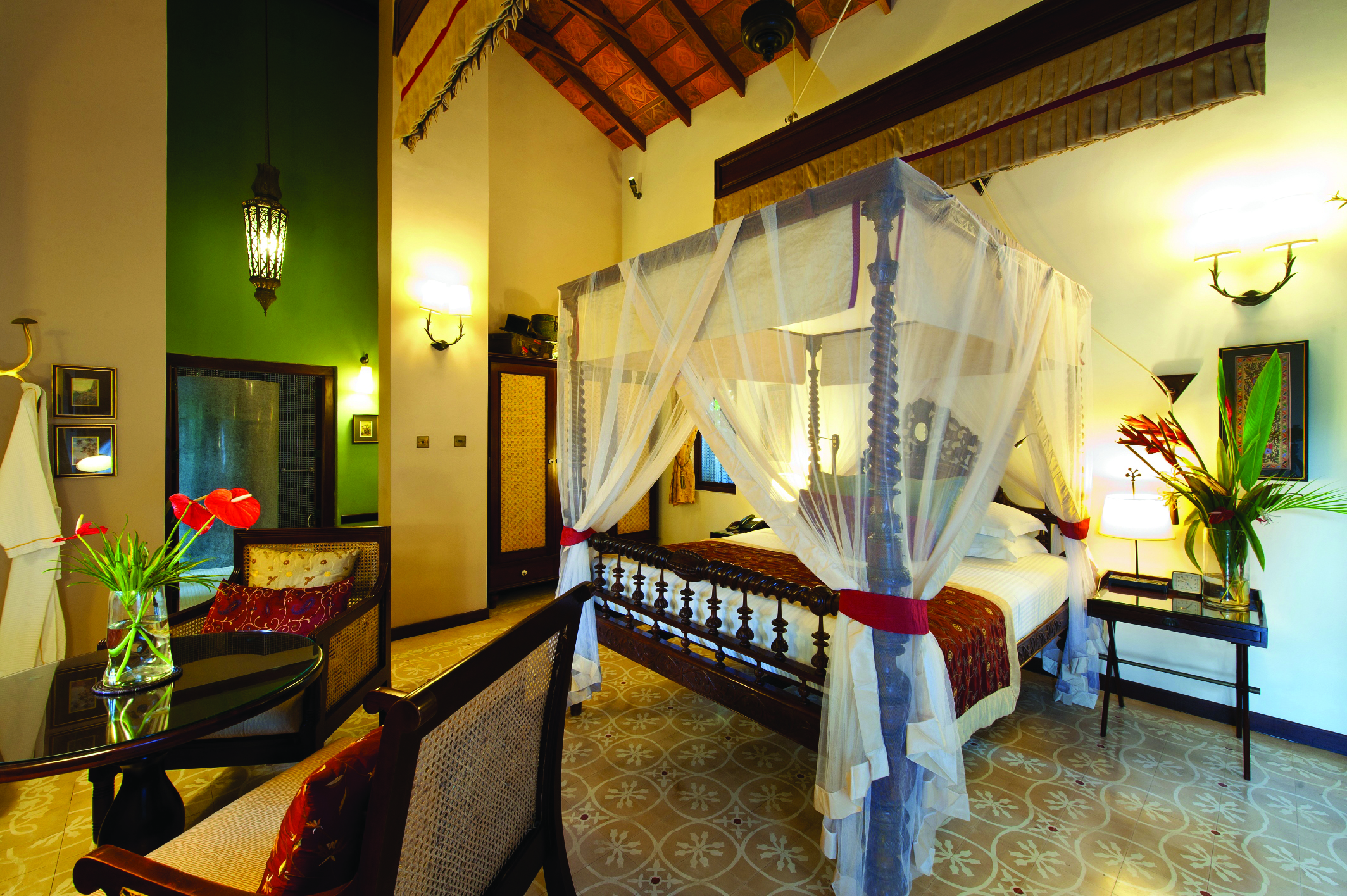 Reef Villa and Spa lily pond suite, canopied bed, antique furniture, elegant decor