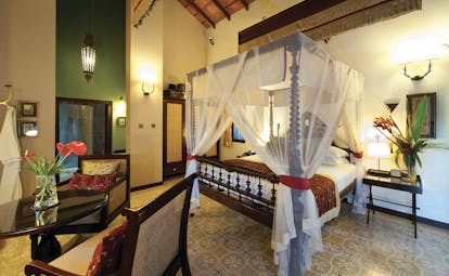 Reef Villa and Spa lily pond suite, canopied bed, antique furniture, elegant decor