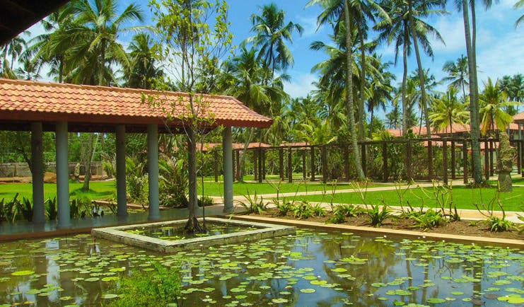 Serene Pavilions Sri Lanka pond lawns palm trees