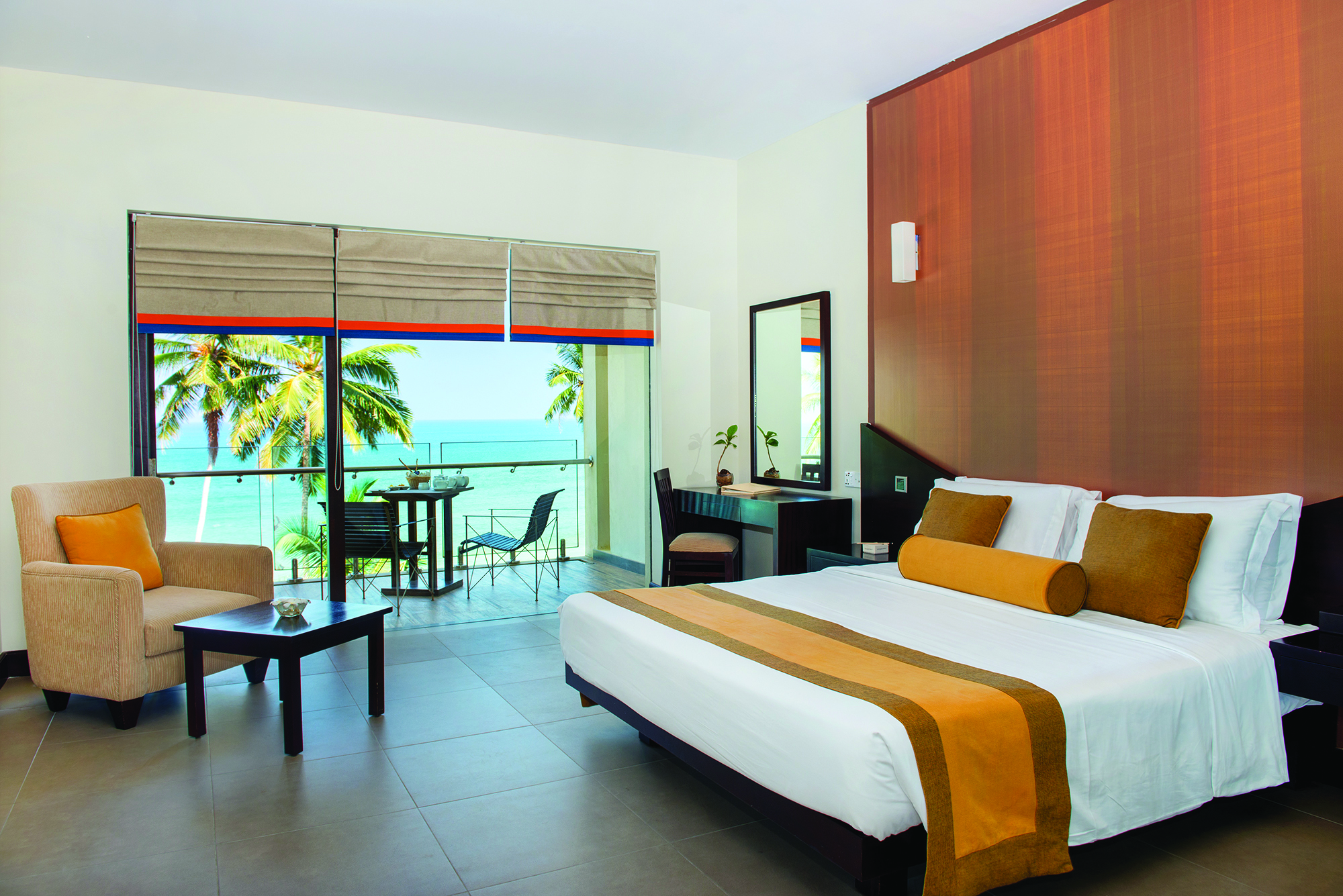 Shinagawa Beach Sri Lanka deluxe room bed armchair modern décor private terrace