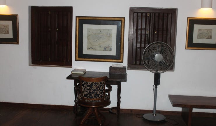 The River House Sri Lanka Menik suite desk and chair fan and wooden shuttered windows