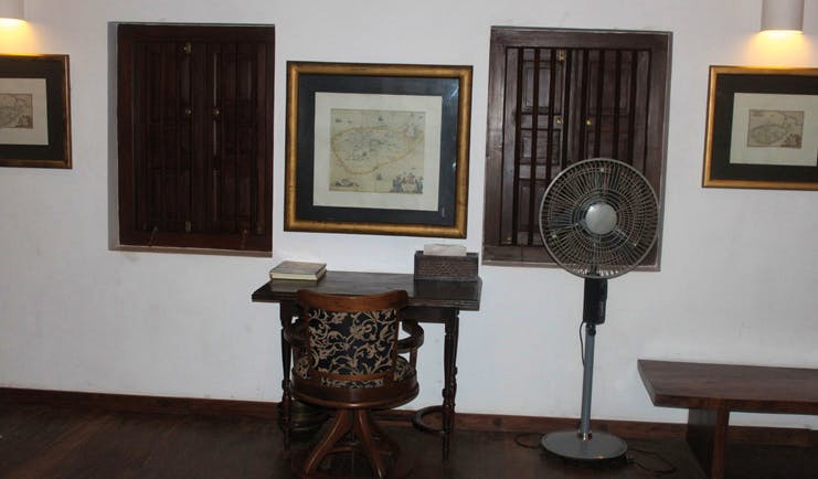 The River House Sri Lanka Menik suite desk and chair fan and wooden shuttered windows