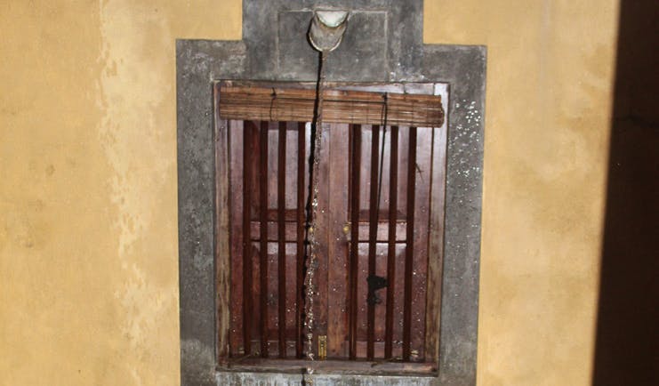 The River House Sri Lanka suite window with wooden shutters and bars