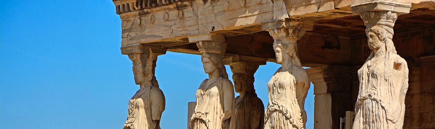 Female statues with roof of temple on heads Athens Acropolis