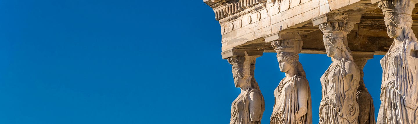 Ancient Greek caryatid statues supporting temple at Acropolis Athens