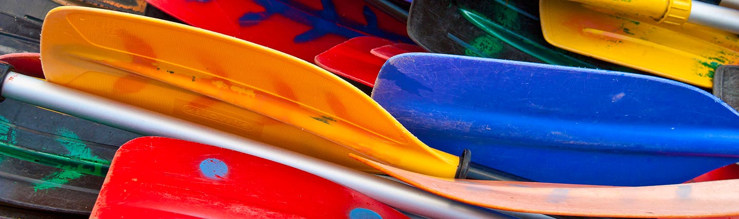 Group of colourful oars of boats