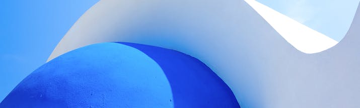 Bright blue dome and white roof of a Greek church