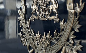 Silver embossed logo on side of the blue Orient Express train